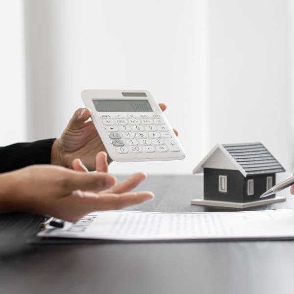 Reviewing final expense and estate paperwork with a calculator